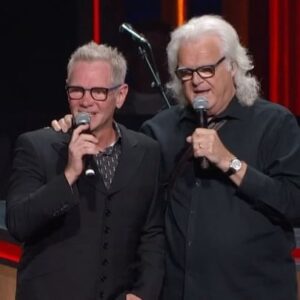Ricky Skaggs Instagram - Multi-Grammy® and GMA Award winning @stevencurtischapman was invited to become a member of the @opry  tonight by Opry member and longtime friend Ricky Skaggs. With 50 No. 1 hits, Chapman is the most awarded artist in Christian music history. The beloved singer made his Opry debut 42 years ago at age 19 when he was a performer at Opryland Theme Park singing the songs of Opry greats including George Jones, Ricky Skaggs and more. 
 
After Chapman’s set, Skaggs approached his friend with a framed photo of a young Chapman from around the time of his Opry debut. “[The archives] have found a picture of [you]. We need to have a picture of this. Where’s Chris [Hollo, Opry photographer]? Get a good picture because this is going to go great beside that picture right there that he’s taking because you are going to be the next member of the Grand Ole Opry, if you want to!? Only if you want to!?” Chapman dropped to his knees excited and in disbelief.  Skaggs said, “I think you want to.” Skaggs continued, “I’m so proud for you bud. You deserve to be here. There’s been greats that have been on this stage and been members of the Opry and we are glad you’re joining the Grand Ole Opry and doing what you do best.” 
 
“That is incredible, brother,” said Chapman. “I can not tell you all how surprised I am. This is a massive surprise. I had no idea, and I am so honored and just so grateful. What an amazing family to be a part of. I was thinking when I started singing tonight on this stage, I really did, this is my favorite place to sing these days. I feel at home, I feel like this is my family. Eveyrone here. I am so honored to be part of this family. Thank you guys. Thank you Jesus, and thank you all.”
 
Chapman’s induction date will be announced soon. 
.
.
#stevencurtischapman #rickyskaggs #grandoleopry