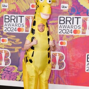 Rob Beckett Instagram - Last night you might have noticed I was at the Brits presenting an award. Here I am looking suave on the red carpet🦒🤌

For my @bbcradio2 show I want to know about the times you got the dress code wrong - on purpose OR by accident. Did you misinterpret a fancy dress theme? Wear the same outfit to a wedding as a member of the bridal party?  Did your friends or family trick you into wearing the wrong thing?

Get in touch with the show! 

Email rob.beckett@bbc.co.uk or comment below🚨
