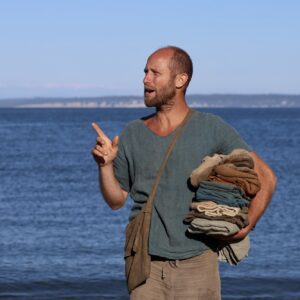 Rob Greenfield Instagram - This is my entire wardrobe.

18 items – 4 shirts, 2 shorts, 1 pants, long underwear top and bottom, shawl, hat, cowl, wool booties, moccasins, 3 pairs of socks and a bag.

All hand made. All natural fiber. All naturally dyed.

Just as a deer could fall to the forest floor and return to the soil, so could I in these natural clothes. 

Wool, linen, cotton, deer leather and sinew and wood are the materials.
Black walnut, indigo, weld, turmeric and iron rust are the dyes.

It’s been a year since the first item was completed and 3 months since I shedded my last clothing from my former life.

I can’t say it’s all been easy. Both shorts have ripped in the butt area and the soles of the shoes have already worn through. Many of the clothes were made too small and seams are breaking where they are too tight. They aren’t the most comfortable clothes I’ve ever worn… But this is all part of the experiment in reconnecting with Earth. I am elated for the trials and tribulations of it all. To live in harmony with Earth is to repair, to rethink and to reconstruct my possessions, my mind and all of my relations.

My wardrobe is not fully complete, and I am calling out to the community for a few items!

To keep my nose and head from burning I am seeking a sun hat. Felted wool or woven plants are my ideal materials, but I’m exploring the world of covering my head with the gifts of Earth!

For warmth, I am seeking a wool sweater. Is there anyone with a homemade, natural fiber and naturally dyed sweater I could buy or borrow until this fall? Or someone who could make one this month? I can source and provide the local yarn!

For soles for my shoes, I am seeking thick, naturally tanned leather as well as some sinew. I only need small chunks, so scraps could do. I’d also love to hear any experiences with long-lasting natural soles!

To make padding for my backpack straps, I need some wool roving.

I’m happy to purchase, trade, or receive as gifts for those who operate in a non-linear, more circular giving system like I do!

Love,
Robin

Photo by Greg Sachs @sachsquatchinthewild
Learn all about my journey to natural clothes at robingreenfield.org/clothes