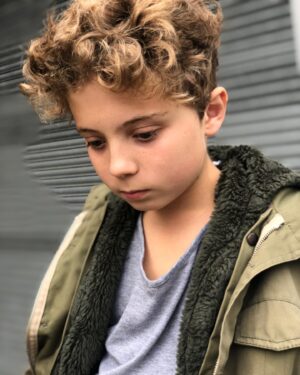 Roman Griffin Davis Instagram - My mum made me pose outside the local supermarket delivery door.