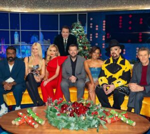 Romesh Ranganathan Instagram - I’m on Jonathan Ross tomorrow night on @itv at 10.15pm I think. It’s a great line up but the star of the show was the button I forgot to undo that spent the night struggling like Spiderman trying to hold that ship together.