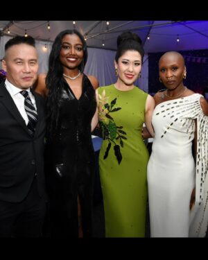 Ruthie Ann Miles Instagram - One of the joys of working with a top notch company like the one assembled by @fogelsean, @michaelcarney & Michael Colbert (but I couldn’t @ him; I don’t think he’s on IG) is that they literally collect people from across our country(!) so we can play together & enrich one another -  and I’m THRILLED that they’ve included 💛BROADWAY (& BROADWASIANS 🤩) to join in 🤩

Here are some BtS by @slovekinpics (Steven Lovekin!) of 
@wongbd - @patinamiller - @cynthiaerivo - @bryancranston & I loving on each other. I’ll commentate on what’s happening.

—Planted in between & soaking in the rays of two of my Queens.
—We pulled B.D. in to join us 
—Cynthia just finished a solo while I went on deck to prep for mine. She was walking down the ramp as I walked up. Perfect timing to snag a little #ALittleNightMusic photo. (I. Can’t. Wait. To. Hear. Her. Sing. MILLER’S SON!!!!)
—I don’t know how I got so lucky to have these two voices singing in my earholes for the finale. We took this immediately after saying Goodnight America. 
—I. Did. Not. Know. Bryan. Cranston. SANG. I tried to give him my mic to hold in the finale, but settled for holding it by his shoulder. What a lovely baribass!!!! <swoon>
—Here’s me grabbing BD by the face to let him know how much I’ve admired his presence and command in our industry, his humor and heart, and his fight for representation and inclusion. (If I grab you by the face it’s because I love you. So take it personally.)
—Did you know there is an Ice Box (which is exactly what that sounds like) for the sweaty or melty folks on the hot summer evening stage?! How considerate! I took a step in for a few moments to say I’d done it. (I did it!)
—There was an after-ceremony ceremony & party where I was asked to sing God Bless America a capella. I really should have thought about the higher end of the melodic scale (I didn’t.) But once I started I had to go with it, up in the stratosphere.. I asked the audience to sing along with me - knowing that it was in a MUCH HIGHER KEY than they had sang it at the Memorial Day Celebration 😅 Y’all were good sports - and the acoustics were terrific! We sounded great! (Thank you Jorge @joegeacevedo for the capture!)