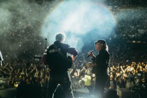 Sam Fender Instagram - The last few days have been insane. Sharing the stage with @brianjohnsontv was a dream come true. When we first started seeing success with our band, me and Dean used to watch interviews of Brian to keep ourselves grounded - he is the prime example of a Geordie who has never forgotten his roots. Not only that, I also brought out my first guitar teacher who showed the entirety of St James’ Park how it’s actually done. Phil Martin, I wouldn’t have been able to do any of this if it wasn’t for your tutelage and back when I had my first band (when we were bairns, 14 or 15) you let us rehearse in the Gasworks practice rooms for free. We need more people like you in our community 🤍🖤🤍🖤