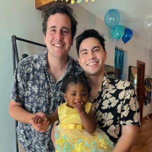 Sam Tsui Instagram - Our first year as dads and it’s impossible to put into words how incredible it’s been to watch Elaia’s joy and wonder as she begins to discover her world. Both @caseybreves and I feel exceedingly lucky to get to be her parents, and we cannot wait for all of the adventures to come!! (Oh and if you want to hear a taste of music we’ve been singing to her, our full album dedicated to Elaia, “Here Tomorrow” is out now!! ⬆️ happy #fathersday everyone!!