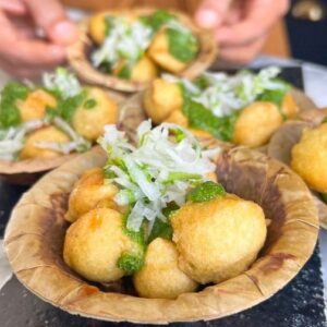 Saransh Goila Instagram - Ram Laddoo or Moong Dal ke pakode is not just a street food dish but an emotion for many. When I was in school, in winters, my grandpa and I would savour many plates for RS. 5 only. The joy of biting into these air light crisp laddoos in the afternoon with sun rays shining on your cheeks was unmatched. I miss him and I miss that Dilli ki sardi and Delhi street food where growing up my only worry was if there will be lal gajar halwa post this laddoo outing with grandpa. Hope you enjoy my recipe for the classic :) 
.
.
Ram Ladoo 

2 cups Moong dal, soaked 
3/4 cup Urad dal, soaked 
3/4 cup chana dal, soaked
2 Green chilies 
A few mooli ke patte
1 inch Ginger 

Blend into a thick batter 
Add 1 tbsp or 2 of water if required 

The batter needs to be thick! 

Add salt to taste 

& beat the batter till light and fluffy 

Look at that 😮‍💨

If the batter floats on top

👍🏻👍🏻👍🏻

A handful of Mooli ke patte 
A handful of Coriander 
3 Garlic cloves 
1 Green chili 
Juice of 1/2 a lemon 
Salt to taste 
A splash of water 
& blend into a smooth chutney 

Carefully drop the dal batter 
into hot oil 

& fry the ladoos till GBC🔥🤤

1 cup Mooli, grated 
A handful of mooli ke patte 
1 Green chili, chopped 
Juice of 1/2 a lemon 
Salt to taste 
Mix everything well

To serve, 

Place ram laddoo in a bowl 
Pour meethi chutney 
Green chutney & mooli laccha 

Delishaaas 😮‍💨🤤