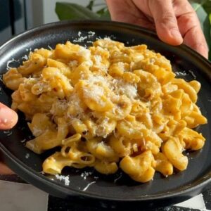 Saransh Goila Instagram - Name your favourite Kaddu or Pumpkin recipe! Waise toh my favourite is khatta meetha kaddu but on somedays this Macaroni makes me say Delishaaas. Will you ever try pumpkin like this?
.
.
Pumpkin Pasta 

😄😄😄
Peel and cut 250g Pumpkin 
1 tbsp Oil 
1/2 tbsp Garlic, chopped 
1/2 tsp Dried basil 
1/2 tsp Oregano seasoning 
1/2 tsp Red chili flakes 
Mix well 
Add the pumpkin cubes 
& mix everything well 
Salt to taste 
1/2 cup Water 
Cover & cook for 10 to 15 minutes 
Mix well 
& purée into a smooth sauce 

1 tbsp Butter 
1 cup Onion, chopped 
Sauté till translucent 
Drink a shot of White wine first 😮‍💨😎
1/2 cup White Wine 

Add the sauce to the onions 
1/2 tsp Sugar 
Black pepper to taste 
Mix well 
1/2 cup Coconut milk 
Mix well

Boil 100g Macaroni 
Add the Macaroni to the sauce 
& mix everything well 

Add Parmesan cheese as much as your ❤️ desires 

Look at that 😮‍💨🤤

Serve the pasta 
& garnish with grated parmesan cheese 

Delishaaas 😮‍💨🤤