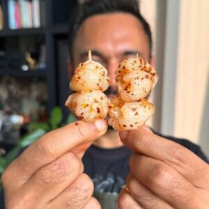 Saransh Goila Instagram - Ever had Litchi like this? This is a childhood favourite where we would freeze a lot of litchi or lychee and then have it with a chatpata masala. These would also make for a fab garnish on top of a drink! Have you had this season's first litchi yet? 

Frozen Litchi 

Peel & de-seed 15 Litchis 
Roll them back as shown 
Place them in an ice tray 
Squeeze some lemon juice 
Freeze for 6 hours 

Dry roast 8 red chilies 
Add them to a mortar 
Castor sugar, to taste 
Salt to taste 
1/2 tbsp Chaat masala 
Pound into a coarse powder 
Look at that 🔥😮‍💨

Toss the frozen litchis with the masala, to taste 
Add them to a skewer 

Delishaaas 😮‍💨🤤🔥