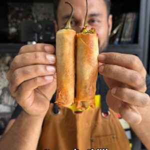 Saransh Goila Instagram - Spicy and nicey bante hai *Dynamite Chilli Lumpia* OG versions are made with meat but we decided to make it desi with aloo and masala! While frying gives best results air frying ones are pretty crunchy as well. Will you try this snack this weekend? 

.
.
Mirchi Lumpia

Eat some chili first 
Slit them as shown in the video 
De-seed the chili 
1 tbsp Saunf 
1 tbsp Coriander powder 
 1 tbsp Jeera 
Crush them coarsely 

1 tbsp Mustard oil 
1 1/2 tbsp Saunf jeera masala 
1/2 tbsp Garlic, chopped 
1/2 inch Ginger, chopped 
1 Green chili, chopped 
Sauté well 
1/2 tsp Haldi powder 
4 Boiled potatoes
Salt to taste 
A handful of Coriander, chopped 
1/2 tbsp Aamchur powder, to taste 
Mix well 

Look at that 🤤🤌🏻

Stuff 1 1/2 of the chili with the aloo mix 
& the other half with mozzarella cheese 
Put 2 together

Take a spring roll sheet 
Place the chili 
& roll as shown in the video 

Look at that 🤌🏻🔥

Baste them with oil or deep fry 
& air fry at 180 degrees C for 15 mins 
till GBC🔥

Look at that 🤌🏻😮‍💨

Delishaaas 😮‍💨
.
.