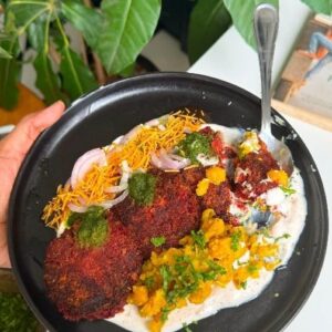 Saransh Goila Instagram - This dish still has my heart, it might have failed to deliver to you guys but I love it! This is a story of failures inside and outside the kitchen and about how sometimes it all just leads to something bigger. We are celebrating 100 Kitchens of GOILA all through this week and I had to make one OG menu dish for the occasion. Will you make this Delishaaas dish at home? 
.
.
Beetroot Tikki Chaat 

1 Beetroot 💞
Grate it 
Sauté it till all the moisture has evaporated 
Add beetroot to a bowl 
1/2 cup Paneer, grated 
1 Potato, boiled 
1 Green chili, chopped 
1/2 tbsp Ginger garlic paste 
1 tsp Red chili powder 
1/2 tsp Bhuna jeera powder 
1 tsp Coriander powder 
1/2 tsp Chaat masala powder 
1/2 tsp Garam masala powder 
Salt to taste 
1/4 tsp Cardamom powder 
Mix everything well 
Look at that 🤌🏻😮‍💨

Shape the tikkis as shown 
Coat them with breadcrumbs 
Shallow fry the tikkis 
till GBC from both the sides 🤌🏻😮‍💨

Look at that 🤤🔥

1 tsp Ghee 
1/2 tsp Jeera 
1 tbsp Garlic, chopped 
1/2 inch Ginger, chopped 
1 Green chili, chopped 
Sauté well 

1/2 tsp Haldi powder 
Salt to taste 
1/2 tsp Coriander powder 
Mix well 

1 cup Boiled matra 
Mix well 
Mash the matra 

Look at that 🤌🏻

Spread dahi 
Place the beet tikkis 
Add the cooked matra 
Green chutney 
Pyaaz 
Imli chutney 
Aloo bhujiya 
Squeeze some lemon 
Garnish with coriander 

Delishaaas 🔥🤤
