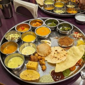 Saransh Goila Instagram - Unlimited Aamras to satisfy my heart, belly and soul. Gujarati Thali at @shreethakerbhojanalay in Kalbadevi, Mumbai is so wholesome, home like and delishaaas. More than 25 dishes are served in just the right portion size for you to sample everything, it's your choice to indulge as much as you want or just have a simple bhaat shaak rotla kinda meal. I loveddd all the farsan, vegetables, pickles and milltet rotlas. Their hospitality (especially Gautam who's head chef and the son and not grandson of Maganlal ji) and seasonality of the menu really amazed me. Take a bow @gemini_man07 and @instabunty I'll be back for more very soon!
.
Also got the pronunciation a little incorrect - it's Thaker (Thaakar) not Thakkar.