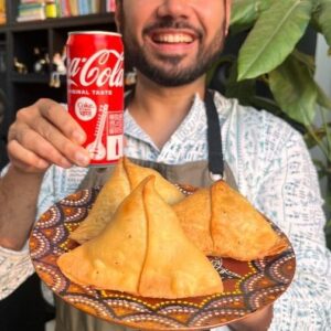 Saransh Goila Instagram - My first music video appearance deserved a special Holi Samosa! All thanks to @cokestudiobharat I cooked and grooved together. Made Gurukripa style A1 inspired samosas in my kitchen to celebrate this Holi while we all groove to Holi Re Rasiya 🕺🕺🕺Have you seen the MUSIC video yet? Go show some love to your chef! What are you cooking this Holi? Also it was amaze to see @bhaiyajiismile @salonayyy saying Delishaaas ☺️
.
.
Holi Samosa

300g Maida 
2 tbsp Ghee 
1/2 tsp Ajwain 
Salt to taste 
Mix everything well 
If it comes together it’s perfect 🤌🏻
Add water little by little 
to form a semi soft dough 
Cover & rest the dough for 30 minutes in the fridge

1 tsp Coriander seeds 
1 tsp Fennel 
1/4 tsp Ajwain 
1/2 tsp Kalonji 
Pound everything well 
into a coarse powder 

Aloo ❤️ you 
Wash 4 boiled potatoes 

1 tbsp Ghee 
1/2 inch Ginger, chopped 
1 Green chili, chopped 
1/4 tsp Hing 
Add the aloo 
A handful of fresh coriander, chopped 
1/4 cup Green peas, parboiled 
Add the Ground masala 
1 tsp Bhuna jeera powder 
1 tsp Chaat masala 
1 tsp Kasuri methi 
Mix everything well 
Salt to taste 
Mix well 

Look at that 😮‍💨🤤🔥

Take some of the samosa dough 
Roll as shown in the video 
Divide the dough into 2 

Apply some water 
Shape the dough 
Seal it well 
Stuff the samosa generously 
& seal the samosa well 

Fry the samosas in low to medium hot oil and make sure it's doesn't bubble up too much!
Till GBC 😮‍💨🤤🔥 

Serve them hot with a chilled can of ✨COKE✨