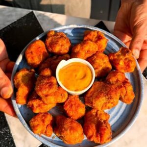 Saransh Goila Instagram - You can phool someone this April because this Delishaaas Phool Gobhi recipe is Phool proof. Looks like it could be fried chicken but when you bite into its crispy on the outside but soft inside. Will you phooling around this April? #aprilfools
.
.
Tandoori fried Phoolgobhi 

Ek Phool aapke liye 😅
1 Cauliflower head, cut into florets 
Blanch the florets 

1 tbsp Mustard oil 
2 tsp Red chili powder 
Black salt to taste 
Salt to taste 
1/2 tsp Jeera powder 
1/2 tsp Ajwain 
1 tsp Kasuri methi 
Mix well 
2 tbsp Ginger garlic paste 
1/4 cup Hung curd 
Juice of 1/2 a lemon 
Mix well 
Marinate the cauliflower well 

2 cups Refined flour 
1tsp Garlic powder 
1tsp Onion powder 
1 tsp Chili powder 
1 tsp Dhaniya powder 
1/2 tsp Garam masala powder 
Salt to taste 
1tsp Jeera powder 
Mix well 

Add the cauliflower 
& SHAKE SHAKE SHAKE 

Press the cauliflower lightly 
Look at that 😮‍💨🤤

Boom boom sauce
1/4 cup Mayonnaise 
1/2 tsp Garlic powder 
1/2 tsp Onion powder 
Salt & pepper to taste 
1/2 tbsp Ketchup 
1 tbsp Sriracha sauce 
Mix well 
Fry the cauliflower in hot oil 
till GBC 😮‍💨🔥

Sprinkle peri-peri masala or tuk masala generously 
Toss well 

Delishaaas 😮‍💨🤤