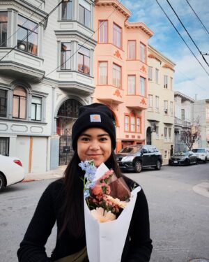 Sari Arambulo Instagram - a flower for your thoughts (my thoughts include how satisfied i am that this bouquet is perfectly matching the coziest buildings) 💐