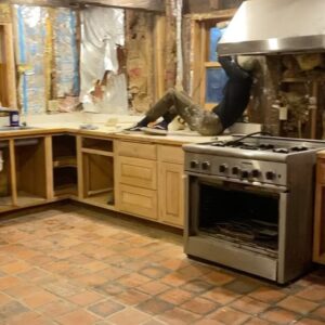Sasha Frolova Instagram - Progress report:
The most daunting, challenging room in the house is by far the kitchen. Simultaneously the hearth of the home and a huge priority to make a safe, cozy room for creating, consuming and keeping company. Everyone suggested we drywall over the drywall but the old drywall had a crazy joint compound texture highlighted by grease and smoke to the point where you could tell where artwork used to hang in the room. We started by ripping the drywall out with an oscillating saw and a crowbar. Mouse poop and dust showering upon us. Mind you, before we had a working shower of the water variety. 
In this process we found original beams behind the drop ceiling! Beams, beams, beams! So we had to take the extra time to reveal those. Once the drywall was all removed we fogged the room with mold spray, filled any holes with mouse spray foam (found in the garden section at Home Depot), new rock wool insulation, and mold resistant drywall. We wanted to highlight some of the beautiful wood work we found in the walls when we demoed them so we made these three little cubbies that were already ‘framed out’. 

As for the appliances, even though I tried desperately to keep the refrigerator to spite everyone, even washed it in the stream before we had running water, it had to go. Hot tip: don’t pay someone to get rid of your fridge! Refrigerators are not allowed at dumps because of the coolant. Find a metal recycling plant and they will buy your fridge for a few bucks based on the weight. Dishwasher was broken. The oven was and is so grease caked but it’s Viking and I’m still trying to save her. My first attempt at cleaning the mysterious 1.5 inch thick goop in the burner trays I found a dead mouse stuck and nearly had to bring a feinting couch over for myself while I scooped it out with my five in one tool. 

The walls and my cracked fingers are now getting a layer of hydrated lime and sand at a 1:3 ratio and then a finishing coat at 1:1. We also framed out a couple of decorative cubbies using an oscillating saw, cut up pieces of paint mixing sticks, joint compound and scrap drywall. 

Onwards and upwards, 2024 ✨thank you for your love and patience @erinwolfmommsen