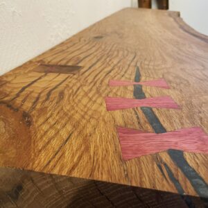 Scott Foley Instagram - Oak entryway bench. Latest project finished. Used part of a live oak slab that I brought from CA.  Through tenons for the solid slab legs. Filled checks with @totalboat 2 part epoxy and made bow ties from some Purple Heart courtesy of @urvi.ivru Adjustable rubber feet to make up for any measuring deficiencies I most likely made. Hand planed then used a card scraper and sanded to 150 grit, didn’t want to close up the pores. Finished with @rubiomonocoatusa oil plus 2C, oak. This thing is a beast, weighs about 200lbs.