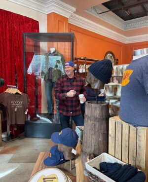 Scott Patterson Instagram - Checking out the Luke’s costume & merchandise at @wbtourhollywood on the set of Gilmore Girls! 🧢 Watch my tour of Stars Hollow & my “I Am All In” Podcast filmed right on the Gilmore set at Warner Bros. Studio! 🚨LAST DAY to grab a virtual stream ticket to watch the event🚨: moment.co/iamallin or go to SCOTTYP.COM (link in bio) - xo S 🧢 Hey there @khaleesigenesis & @eriarroyo , thanks for the 📸 !! 
@scottgordonpatterson @gilmoregirls @iamallinpodcast @warnerbrostv @scottypsbigmugcoffee @iheartpodcast @iheartradio @warnerbrosentertainment @scottpattersonmusic @momentworld 
☕️
#starshollow #lukedanes #iamallinpodcast #gilmoregirls #lukesdiner #ScottPatterson #warnerbrosstudiotour #holidaysmadehere #scottypsbigmugcoffee #gilmoregirlsrevival #gilmoregirlsreunion