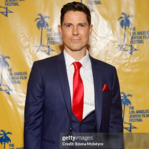 Sean Faris Instagram - So happy and proud to have this opportunity to finally share about the incredible work that my exceptionally talented wife @cheriealexandra put into starring in #GunsandMosesmovie just 6 months after giving birth to our lil firebird! Such a beautiful night taking a turn on the red carpet with Cherie who absolutely crushed it, making that @houseofcb red dress look stunning 😍 ❤️‍🔥💯 This is just the beginning boo! Many more to come! #wearelimitless