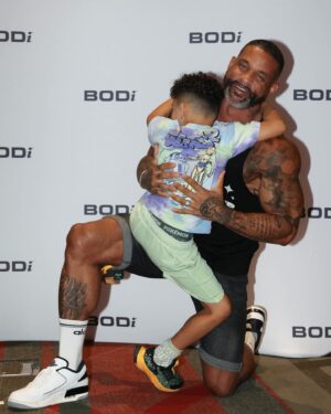 Shaun T Instagram - 🤯Who knew that 20yrs ago when I was introduced to @bodi I would one day be flexing with my son at their biggest event of the year? 🥰 And that made me think of how I am so thankful for the countless number of you that I have been honored to flex with throughout the time I have been partnering with @bodi . ➡️Keep DIGGING DEEPER YALL, no matter what 💪🏽 and LOVE YOUR BODY during the process.♥️ Lastly, it’s never about my newest program or the next program- ITS ABOUT YOU CHOOSING TO DO WHATS GOING TO HELP YOU STAY COMMITTED. 🙏🏽
#staythecourse