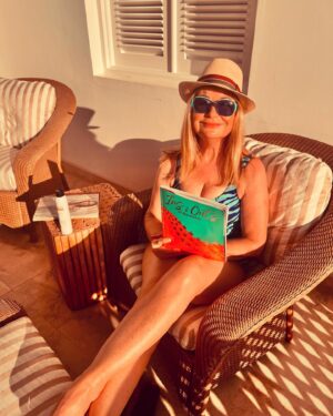 Siân Lloyd Instagram - Slathered with SPF on the balcony in the Barbados sunshine 🌞  #hat #sunglasses #protection #spf #heliocare #barbados #swimsuit #reading #balcony