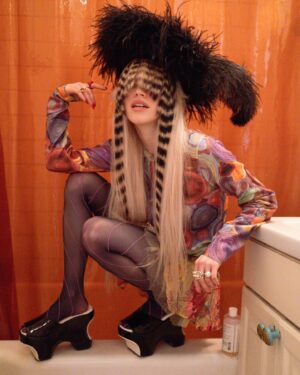 Sideara St. Claire Instagram - U wake up in the middle of the night for ur 3 AM pee and this is what u see WDYD????
 
Obsessed w everything going on here - wearing my fav @shopsideara feather hat with incred @pelitozlocos spiral bang hairpiece, dripping in @desertstarsvintage (this Todd oldham cardigan pleaseeee) shot by lovely lovely @alyssa_tiffany and styling with angel @josienolann what a fun day !!!

I’m finishing up my new collection for @worldofmyownnyc’s show on the 26th and I’m very excited!!!