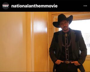 Simon Rex Instagram - Now listen here y’all. I’m fixin to explain this cowboy regalia. It’s my new character Roy Lee Dean I play and he’s a real rascal. And he’s coming to a theater near you this year (I think) - now carry on or you’ll be pushin up daisies. @nationalanthemmovie