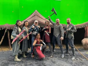 Sophia Brown Instagram - 🤠🎞️📍💫🌱
⁣⁣
1. The Journey to Xin’trea.🌪️🥁

2. Me learning to play the Black Rose on the Nyckelharpa! 🎻 - Thank you so much @nyckelvix 

3. Three way fight from end of Ep1 - With our glorious stunt doubles. 🙅🏾‍♀️🙅🏻‍♀️🙅🏻‍♂️

4. Post Bank Fight 🩸💰

5. Me and Laurence playing around in Zacares Marsh of the Mists 😶‍🌫️