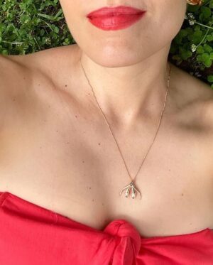 Sophia Wallace Instagram - Sophia Wallace, @sophiawallaceartist artist, and 2021 CRAVE Foundation grant recipient just released the "Unconquerable" necklace collection for preorder. The collection includes rose, yellow & white gold in solid 14k gold, with and without gemstones. ⁠
⁠
Sophia is wearing a gemstone prototype in rose gold with a deep aqua sapphire. "Unconquerable" orders will ship in September. Pre-order here: http://yescliteracy.com⁠
⁠
Artist statement:⁠
⁠
My whole body is precious and belongs to me alone. I am not ashamed, I am grateful. My body allows me to feel, to move, to help, to sense, to take action. I was taught to feel ashamed but that shame does not belong to me. I release it. I meet my whole self with humility and awe. This body is changing and aging. It has given me so much that I was too immature to appreciate until I faced my own mortality and that of my parents, who were always so strong and healthy. I will do my best to take care of my body, knowing that my mind, soul and physical self are indivisible. I reclaim all the denied parts of myself. I bring us all home.⁠
⁠
Sophia Wallace is a queer, feminist artist best known for establishing an iconography of the clitoridian. For eleven years, Wallace has sculpted, sketched, pasted, inflated and spoken this subject into indelible presence. Artwork by artwork, she counters a suspicious absence in art history, centering clitoridian subjectivity in a world that venerates the phallic. Wallace is exhibited widely in the U.S. and internationally, including Portugal, Spain, Austria, Mexico, Italy, Nigeria, Australia and the U.K.. Her featured TED talk, A Case For Cliteracy has been viewed over 2 million times. She can be seen on BBC/Hulu’s Planet Sex with Cara Delevigne and in The Dilemma of Desire alongside CRAVE co-founder Ti Chang, the winning documentary film at SXSW in 2020.