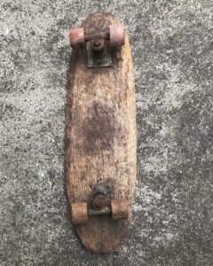 Stacy Peralta Instagram - I was 7 or 8 when this skateboard was handed down to me from an older kid on the block, it’s my first board and this is how I got hooked; down the street from the home I grew up in was a busy shopping center, Steve’s Rexhall Drug store was the corner of it which was on Venice and Centinela, it’s entire perimeter surrounded by beautifully groomed pavement with lots of foot traffic.  I was skating there one busy Saturday: kids were darting around on bicycles, pedestrians and others pushing shopping carts and strollers.  I remember weaving and dodging through all of them, the kids and parents, the shoppers clenching their shopping bags all the while avoiding them and highly aware that if I hit the most minute crack in the pavement or the tiniest pebble that my clay wheels will lock up and catapult me into concrete.  Here I am a young kid standing on this new invention called a skateboard, a little platform of wood and four rock hard wheels, it has no handlebars to hold onto or seat to sit on or pedals to rest my feet on, unlike a bike it’s a very insecure device and far more dangerous and far more tricky to figure out, and as I whiz through all of the people I can feel the hard rumble of the clay wheels vibrating up through my feet and legs, I’m at this little board’s mercy and yet amidst all of this chaos and frenzy coming at me I suddenly feel this incredible sense of stillness.  Stillness?  I’m weaving through waves of people and things, hundreds of sensations are hitting me including the fear of falling and yet I feel completely still inside.  It made no sense to me yet the feeling was intoxicating and it was something I’d never felt before that moment.  How is it possible that I could feel such stillness when at that very moment I might face-plant into a metal shopping cart or get bounced off pavement.  It is that sublime experience of feeling still while moving rapidly on my board that hooked me to skateboarding, that feeling of profound stillness coming from within while at the same time everything outside of me is chaos and craziness.