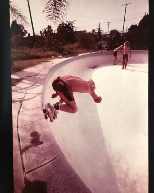 Stacy Peralta Instagram - Another very rare board from my collection and the story behind it: Right after the collapse of the Zephyr team and months before getting sponsored by Gordon&Smith I was sponsor-less, as were many Z Boys at that time.  Bob Biniak had just hooked up with Sims and said to me one day; “You need to get off your Zephyr board, you need a board with a kick-tail for the pools we’re riding.  He then handed me a flat wooden Sims board and said; “Go home to your kitchen, boil a pot of water like you’re gonna make spaghetti, drop the tail in the pot and boil it over night.  In the morning take the board into your garage, clamp it from the middle into a vice, tie a piece of rope around the tail, pull the rope as hard as you can until the tail bends and then tie the rope to a hook in the wall.  Let it sit for a week.  After that you’ll have a board with a kick-tail.  I did exactly as Bob said; I dropped the board into a pot and boiled it overnight.  Next I clamped it into a vice, pulled back the tail and tied it to a wall.  A week later, I untied it, opened the vice and there it was, a board with, if not an actual angled kick-tail, a tail with a really strong and effective warp.  I mounted it with Bennett Trucks and Sims Pure Juice Wheels. Later that day we got word of a new pool way out at the far end of the San Fernando Valley in an area of old farm houses and orange groves.  We were told a 90 year old woman lived on the property but she was hard of hearing so sneaking in wasn’t a problem. Biniak, Alva and I drove out in my VW Squareback, found the place, hopped the fence and encountered what I still consider today to be the best backyard pool I’ve ever ridden.  We called it the Devonshire Pool because it was the Devonshire exit off the 405 freeway.  That Sims board rode incredibly well and was a huge step up from my Zephyr and the tail worked just as Biniak had said.  Shortly thereafter Gordon&Smith came to me with a great offer.  At my contract signing Larry Gordon asked me what I’d like to call my new skateboard model, to which I replied; “Why don’t we call it the Warptail?”
