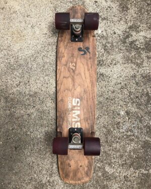 Stacy Peralta Instagram - Another very rare board from my collection and the story behind it: Right after the collapse of the Zephyr team and months before getting sponsored by Gordon&Smith I was sponsor-less, as were many Z Boys at that time.  Bob Biniak had just hooked up with Sims and said to me one day; “You need to get off your Zephyr board, you need a board with a kick-tail for the pools we’re riding.  He then handed me a flat wooden Sims board and said; “Go home to your kitchen, boil a pot of water like you’re gonna make spaghetti, drop the tail in the pot and boil it over night.  In the morning take the board into your garage, clamp it from the middle into a vice, tie a piece of rope around the tail, pull the rope as hard as you can until the tail bends and then tie the rope to a hook in the wall.  Let it sit for a week.  After that you’ll have a board with a kick-tail.  I did exactly as Bob said; I dropped the board into a pot and boiled it overnight.  Next I clamped it into a vice, pulled back the tail and tied it to a wall.  A week later, I untied it, opened the vice and there it was, a board with, if not an actual angled kick-tail, a tail with a really strong and effective warp.  I mounted it with Bennett Trucks and Sims Pure Juice Wheels. Later that day we got word of a new pool way out at the far end of the San Fernando Valley in an area of old farm houses and orange groves.  We were told a 90 year old woman lived on the property but she was hard of hearing so sneaking in wasn’t a problem. Biniak, Alva and I drove out in my VW Squareback, found the place, hopped the fence and encountered what I still consider today to be the best backyard pool I’ve ever ridden.  We called it the Devonshire Pool because it was the Devonshire exit off the 405 freeway.  That Sims board rode incredibly well and was a huge step up from my Zephyr and the tail worked just as Biniak had said.  Shortly thereafter Gordon&Smith came to me with a great offer.  At my contract signing Larry Gordon asked me what I’d like to call my new skateboard model, to which I replied; “Why don’t we call it the Warptail?”