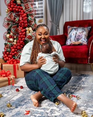 Stan Nze Instagram - May the joy of this season never depart from your household. Merry Christmas 🎄

with ❤️ from The Nzes 

PJs by @kwuchiz_stitches 
Tree by @surprisecore 
Photographed by @thomfelix_concept 

#MerryChristmas #TheNzes #Jaybobo #Ngozichierika