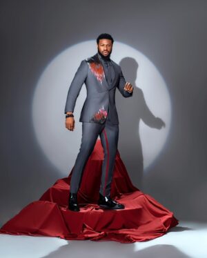 Stan Nze Instagram - Tall Glass of 🍷

As designed by @p.ariesofficial 
Photographed by @thomfelix_concept 

#TheScarletSuit #MaziNze #NewWine #Fashion #FashionableBlackMen