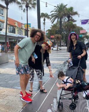 Stefan Gordy Instagram - #FooFriday 1-12-24  Aussie Time 19 hours ahead of L.A. time 
Spotlight on a Revisit 11 years later!  When adding 2 new members to the FooFamily, ya gotta show them where the video "Let's Get Ridiculous" was filmed at Manly Beach near Sydney almost  11 years ago.  Directed by Mickey Finnegan and 175 million views later and hitting #1 on the charts, the video holds up. The plot of the video involves Redfoo,  who is being charged for crimes against conformity which was contributed to the worldwide epidemic, escapes from the Boeing 747-8 while he was being deported. Now a free, but wanted man, he lands on Manly, NSW after taking a selfie with his smartwatch, and ends up being chased by the police upon greeting them and seeing the wanted poster of Foo himself. 
Our host Adam Kennedy was also worked on the video and he brought along his 3 kids, Pearl, Xavier & Tess to reminisce about the fun action. Momfoo brought along their finished children's book which now can be purchased in Australia 
https://partyrockmerch.myshopify.com/
We visited the Manly Library and just loved the atmosphere.
It rained most of day but the rain didn't manage to dampen our revisit....Australia is a very special place and the video attached is a preview of our visit to the Opera House & Harbor Bridge...What's Australia without an Aboriginal performing magic on a didgeridoo?  I trust if you do a revisit it's as good as ours. G-day mates....more next FooFriday!
LGR Video
https://youtu.be/CdLhdrNgGu4?si=8mgV4iJO-8fM8kcc
xxxNancy (Momfoo-Grandma LaLa