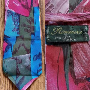 Stephen Fry Instagram - A Tie Rack edition today. Older viewers will remember how every High Street and railway station used to boast a Tie Rack store. Some were little more than booths or kiosks. Along with Sock Shop the chain exemplified a corner-turning moment in 80s and early 90s retail style and habits.

Pic 1 (swipe left) shows a standard Tie Rack tie, with a standard Tie Rack label. Fine in its way – has a pleasing mauve sheen when you turn it in the light.

Pic 2 displays a “Primavera For Tie Rack”. Was Primavera (the Italian for “spring”) an in-house design studio, I wonder? Did the extra name on the label indicate a “designer tie” with a corresponding hike in price? The word “designer” was beginning to be prepended to everything from sunglasses to boxer shorts back then.

Pic 3 shows two “Charleston Tie Rack” specimens.

Swipe left again for a “Chevalier” tie which looks to be greatly influenced by Versace (yes, doesn’t it need a damned good steam?) Pic 5 is “Angelo Bosani”. I wonder if Signor Bosani designed exclusively for Tie Rack? Certainly if you search for his work on eBay and elsewhere they all seems to be Tie Rack items.

Can we discern a distinct difference according to label? Every one of them is 100% silk and all declare themselves to be made in Italy (except the Chevalier which doesn’t reveal its origin). I would say the two Charlestons and the Primavera have a certain something in common, an almost watercolour effect perhaps, whereas the Pic 1 Tie Rack, the Chevalier and the Angelo Bosani are all individual unto themselves.

It’s of no great matter, doubtless some marketing figure decided that there should be this variation in labelling. Tie Rack has gone to retail heaven where it is kitting out the angels in good, but not great, fine but not fabulous, quality but not costly, neck wear. I wish them a blissful eternity, or as Horatio almost phrased it to the dying Hamlet, “Good night, sweet Tie Rack, and flights of angels sing thee to thy rest.”