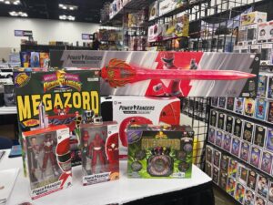 Steve Cardenas Instagram - Hey guys! Getting this set up for @indianacomicconvention here at @rangerstop_convention booth 2507!  But I’m posting this pic right now to say that if anyone wants some of or all of this merch you see here, DM me immediately and it can be yours! Signed personally by me and shipped directly to you.  Hit me up and I’ll can give you pricing and such!  This is limited time offer tho, so if you can’t make the convention and you want any of these killer MMPR collectables DM me IMMEDIATELY ! Otherwise I’ll see you here at the con! 👍