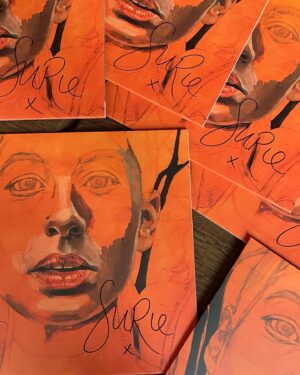 SuRie Instagram - Did you miss out on a signed Building A Woman vinyl when they sold out? No fear, I signed a few more and as a special Bandcamp Friday treat TODAY @fetchhappenedrecords is giving you the opportunity to nab one. Best be quick! 
🧡 surie.bandcamp.com

Cover art by the magnificent @heloisetoop