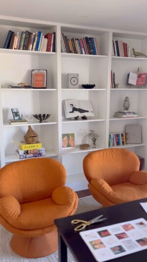 Summer Bellessa Instagram - I shouldn’t be posting this yet, BUT with work on the house moving at a snail pace, I’ve gotta take my wins. At the beginning of the year I bought these Billie bookcases from @ikeausa with the extenders. We talked about all the different ways we could do the DIY built in bookshelves. (I also priced out having the built in made without the premade bookshelves, and it would’ve been about 5x more expensive.) We decided to put them on a base, and use wood to keep them in place, then I just painted them to match the walls. Styling is my favorite part, and it’s just the beginning, but I grabbed pieces I had thrifted, art from @miriamtribe and other artists and special pieces bought from local sellers like @mother.daughtermercantile (the brass dove and marble vase). I gave away a ton of my books when we moved, but I’m displaying some of my favorites: a germain Audrey Hepburn book, @lisacongdon colorful happy book, and a first edition of Breakfast at Tiffany’s. I also have my collection of magazine pages I’ve saved since I was a teenager. Next step is to fill it up! What else should I put in there?!? #casabellessa #diybookshelf #bookshelfie #builtin