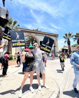 Susie Castillo Instagram - Couples who strike together, get paid together❤️✊🏼

Joined the picket line at Paramount Studios today in support of the #sagaftrastrike #wgastrike 

I’ve been a member of SAG AFTRA since 2004 and have seen the industry change significantly (for the worst) for most actors and writers and it’s about time our contracts reflect the HUGE change that streaming has brought to the industry during that time.

Streaming services don’t want to share their profits with the creatives that bring these shows to life. Shame on them for paying their CEOs multi-million dollar salaries per year (see what Paramount pays their CEO in my last slide) and not paying living wages to the majority of actors/writers and other folks who work behind the scenes on the shows and films we all love.

We’ll be out here for as long as it takes to work out a contract that’s fair and just. LFG!

#sagaftrastrong #sagaftramember 
#wgastrong