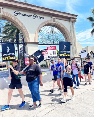 Susie Castillo Instagram - Couples who strike together, get paid together❤️✊🏼

Joined the picket line at Paramount Studios today in support of the #sagaftrastrike #wgastrike 

I’ve been a member of SAG AFTRA since 2004 and have seen the industry change significantly (for the worst) for most actors and writers and it’s about time our contracts reflect the HUGE change that streaming has brought to the industry during that time.

Streaming services don’t want to share their profits with the creatives that bring these shows to life. Shame on them for paying their CEOs multi-million dollar salaries per year (see what Paramount pays their CEO in my last slide) and not paying living wages to the majority of actors/writers and other folks who work behind the scenes on the shows and films we all love.

We’ll be out here for as long as it takes to work out a contract that’s fair and just. LFG!

#sagaftrastrong #sagaftramember 
#wgastrong