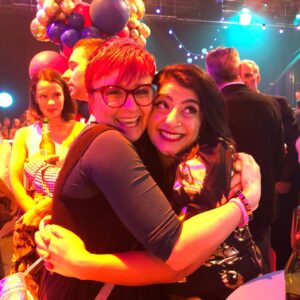 Susie Youssef Instagram - I love Cal Wilson. I was a fan before I was her friend so I felt ridiculously lucky when she became one of my biggest cheerleaders. Her friendship changed me. God, she made me laugh. How could you not smile at that human rainbow. She made me want to be better as a friend and as a comic. She kept my heart safe when I shared my worries with her and I will miss her more than I can say. I haven’t wanted to write this post because it doesn’t matter what I write, it won’t do her justice. I can’t contain the feelings I have for her in a few words. I kept thinking of a Stephen King quote about how the most important things are the hardest to say because words diminish them and we want more than just to say the thing, we want an understanding ear (I’ll post the actual quote) 

And then I realised that there are so many understanding ears because she was universally adored. I have no doubt of her love for her friends and family because she said it and showed it constantly. She loved with every fibre of her beautiful Lincraft-loving heart.

I’m so grateful that I got to hold her masculine hand this week and kiss her head and tell her I loved her. I’m still angry that she’s gone. My heart breaks for Chris and Digby. I don’t know how to finish this except to say that when the anger and heartbreak passes, if it ever does, I have so many memories that will make me laugh and cry and I know how lucky I am for that.
