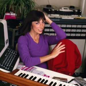 Suzanne Ciani Instagram - Chicago! On Friday, May 17, Suzanne Ciani brings her Particles & Waves Tour to your city, presented by immersive series Age of Reflections (@ageofreflections). 

Each night, Suzanne combines live Buchla improvisation with themes from Seven Waves, her dreamy 1984 solo LP. It’s alternately melodic, noisy, tranquil, and visceral… in other words, a breathtaking experience, presented in quadraphonic sound, paired with a projection-mapped light show. 

Tickets on sale now at our 🔗 in bio. 

⎐ CHICAGO 
Friday, May 17
Fourth Presbyterian Church
w/ Jeremiah Chiu
↳ presented with Empty Bottle

🌊🌊🌊🌊🌊🌊🌊 

📷: 1) Seven Waves-era Suzanne in her studio, 2) Suzanne live at Reflections by John Vogler, 3) album art, 4) tour flyer