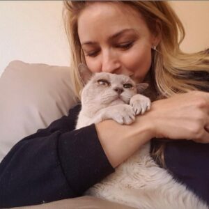 Tabrett Bethell Instagram - Happy 18th birthday to this Little Rock star ⭐️. Today is her birthday 🥳 
I remember driving you home for the first time to my little flat in Kings Cross. I remember my 23 yr old self going to collect you in my silver holden barina with my jet black hair, red hoodie and skinny jeans and walking into a sea of little lilac Burmese everywhere and saying to my friends who came with me, “ how do I choose” ?? The breeder saying “look at this little one at your feet, looking at you “and there you were waiting for me. Ready! 
From the moment I met you I knew my heart had been stolen , you have the ability to thaw out the iciest of hearts. You inspired many of my friends through the years wanting their version of a lilac Burmese Mischa but the thing is , there is only one you. My little soul mate, the loyal guardian. Remembering throughout the years laughing at  boyfriends of mine squabbling to be able to sleep with you in their arms but with determination keeping you in mine. You became my heart. My whole heart. You taught me selfless love. How was I to know back then at 23 I’d have 18 years living with such an enigmatic energy. A cat with her own international passport. A cat for me to adore for all of eternity.
There are so many people to thank for looking after you over the years… Evelyn , @drevil1149  omg, you Angel.  Thank you to you and your father for driving all the way from Arizona to LA to pick Mischa up to care for her all those months while I had to head back to Australia. You are an angel from heaven! @lauragordon____ & Nick Barkla for taking just wonderful  care of her in LA. @danielle_mcc for caring for her so beautifully. @julianmeagher for your care with her even though you are so allergic , she got in your heart though 😁.. Of course Matt C for teaching her naughty tricks and last but not least the worlds best vet , #bennyandthepets -Ben-@bennyandthepets for doing everything you could to help her and me in the last 12 months. So very Infinitely grateful. 
Happy birthday my darling little girl. 🥳🥳🥳🥳
I love you Mischa.. Forever and always. ❤️
Your body maybe gone but you are just everywhere.🤩🌈⭐️🙌