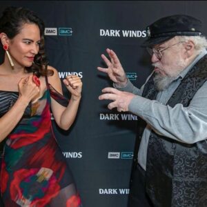 Tania Larsson Instagram - I had the honour to make jewellery pieces for @jessicamatten for her Dark Winds premiere in Santa Fe, here pictured with George R. R. Martin.

I created this ring using vintage beads, antique steel cut beads and 1ct of yellow diamond beads on moosehide. It is tufted with hand dyed caribou hair and backed with caribou hide. The band is sterling silver.

I made matching post earrings with long hand carved muskox drops.

My fiancée Razelle saved the day when she flew with these pieces to New Mexico to attend the premiere herself as she was a writer on the show and hand delivered them to Jessica.

❤️@razellebenally is so supportive. She saw me in tears earlier in the week because a whole box of jewellery I had made for Jessica Matten was lost by UPS and never made it on time for her special events which was heart breaking. I’m so thankful to Razelle for offering to hand deliver them. 🥰

Make sure to watch Jessica Matten in Dark Winds premiering tonight on AMC or stream it online!

#gwichinfinejewellery #cariboutufting #darkwinds #jessicamatten #georgerrmartin #indigenousactress #indigenousartist #nativeartist #nativejewelry