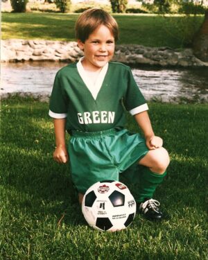 Taylor Kitsch Instagram - This picture was taken my first day back from a 2 season suspension from the ‘mini squirts’ league. Countless hrs of anger management. Grueling therapy. Padded rooms...after many safety hearings I was finally allowed back. What a journey...BUT as ya can tell by the fists, I’m BARELY holding it together...waiting to strike.To inflict.. Pure/raw violence streaming through the veins. 
Wasn’t allowed in team photo obv.
The extreme low V was simply a speed thing. Quite possibly reached my full potential that day.
Green Machine.
(Later that day I was also seen having a strawberry sundae)