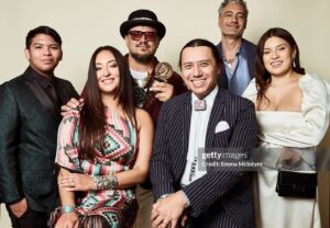 Tazbah Chavez Instagram - I first met @sterlinharjo and @taikawaititi about sixteen years ago when I was interning for @birdrunningh2o at Sundance — years after first meeting him when I was 16 on a film panel for my first short film. Through Bird, Sterlin and Taika instantly became my brothers/sisters and over the years they have been two people who called me what I was before long before I would call myself it: a writer, a poet, an artist, a filmmaker — then they invited me to make @rezdogsfx with them and it’s been the most rez boujiest time of my life alongside our fellow writers, producers, cast and crew. To be honored by @peabodyawards alongside them, presented by badass @kali_ko_reis , is pretty unreal — and a testament to their own perseverance and commitment to bringing others up with ‘em. And selfishly, anytime spent with @paulinaalexisofficial @lanefactor and @bobbydues is simply… blessings! 🪶 🐕 love love love [dress: @byellowtail . m/u: @paintedbypetra . shoes: @happy_brain lemme borrow them . jewels: 6th gen family heirlooms . hair: aveda taught me]