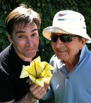 Thomas Gibson Instagram - golfin with the late great Mac Davis and remembering to stop and smell the copa d’oro 🌼#tbt (they smell like coconut!)
