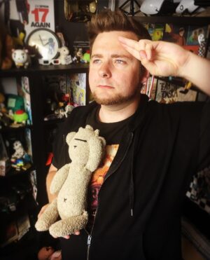 Thomas Ridgewell Instagram - It's always sad to say goodbye, but sometimes it's for the best. Tomee Bear's journey started around 14 years ago with my earliest appearance in Edd's work as a character named "Tomee" in his series "Bendee Stick". Although the series ended, the name "Tomee" stuck around and soon a teddy bear with a similar design and name started appearing in the background of his new series, "Eddsworld". After a few years, a fan gave Edd a handmade Tomee Bear at a convention and not long after (in 2010) he gifted it to me and I kept the tradition of tucking the old guy into the background of my videos up until this day. However, it's time to move on with my life and that means letting go of some old traditions. Instead of leaving ol' Tomee here resting on a shelf like the other relics of my career I'd rather he find a new life with a new life. That's why I've entrusted him to look over @eddiebowley's soon-to-be son, Rik. May the little bugger not tear his head off within minutes. So long, old friend, and farewell.