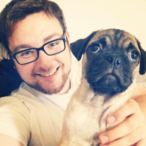 Thomas Ridgewell Instagram - Meet Squidge the pug, mine and @bellerspi's pudgy son. His interests include sleeping, eating grass, chewing toes, throwing up said grass and immediately eating more grass. In short, he's a very good boy. He's actually a pug/cavalier mix because pure puggos have so many health problems, the poor things. I've actually wanted a pug called Squidge ever since I left university so I'm pretty thrilled, to put it lightly. Hopefully I can raise him better than I raised myself lol.