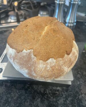 Travis McElroy Instagram - This is a sourdough beer bread using a vanilla porter. It also has a “beer paste” (vanilla porter spelt flour) added to top just before baking to give a crunchy top. Recipe from a Paul Hollywood book.
