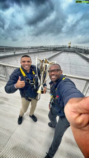 Ugo Monye Instagram - The @europeanrugbychampionscup trophy has arrived in London for the finals this weekend! 

Join DHL Rugby ambassador @bryanhabana_ and a ‘surprise’ guest 😄 as we explore the city before delivering the silverware to @tottenhamhotspurstadium. 

#RugbyDelivered #InvestecChampionsCup